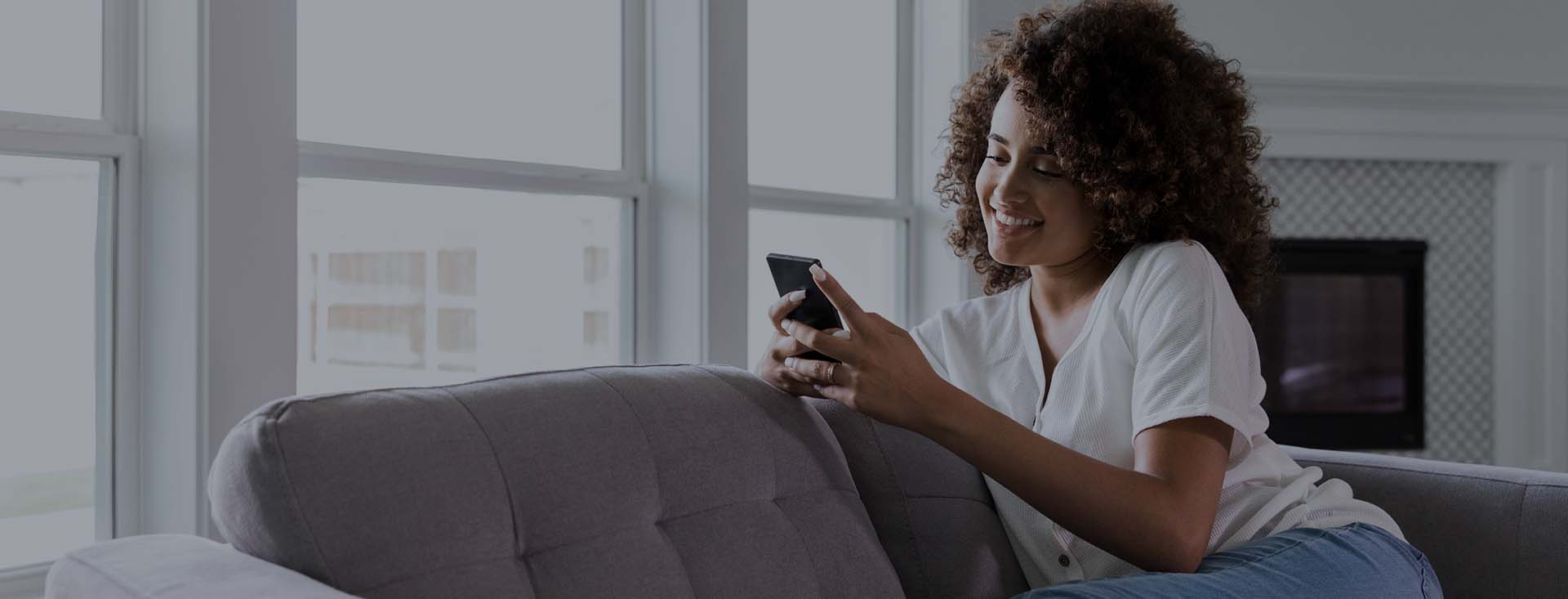 woman looking at her phone