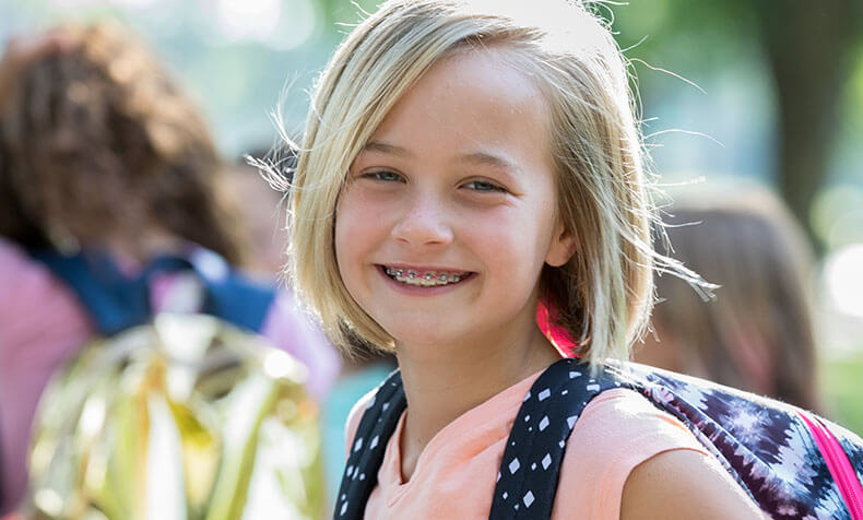 little girl wearing braces