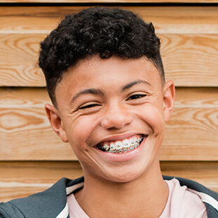 smiling boy with braces