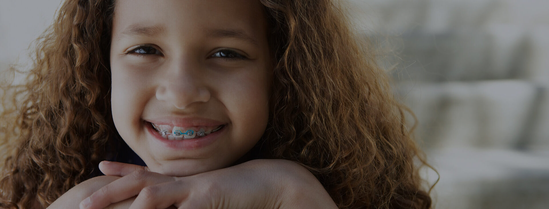 smiling girl with braces