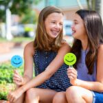 smiling young girls in braces, orthodontic care to establish healthy smiles